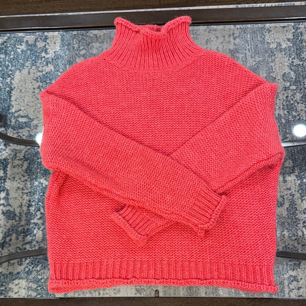 Cozy Anthropologie sweater in coral pink